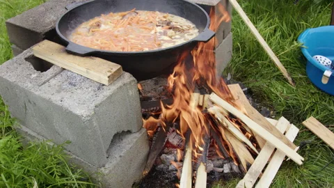 The pilaf is cooked over a fire Stock Footage 304097150