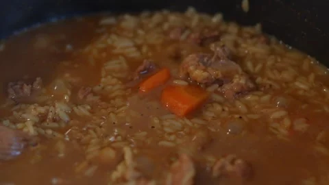 Pilaf cooking in electric multicooker pot with rice and meat. Stock Footage 343892369