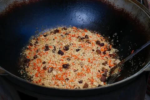 Pilaf cooking on a fire. Stock Photos