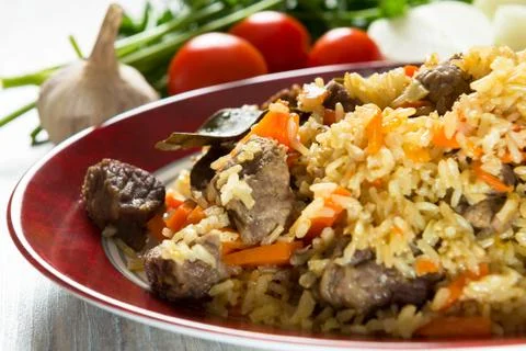 Pilaf on the dining table Stock Photos