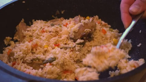 Pilaf in a frying pan 4K Stock Footage 150286605