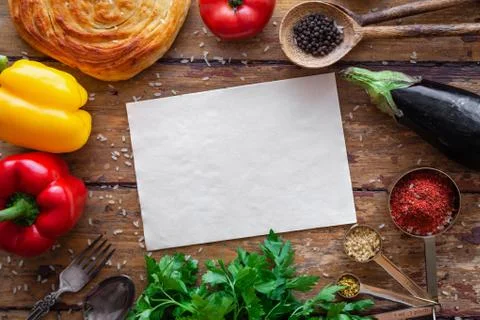 Pilaf ingredients on rustic surface with space for your recipe on paper Stock Photos