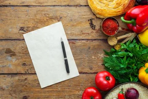 Pilaf ingredients on rustic surface with space for your recipe on paper Stock Photos