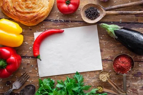 Pilaf ingredients on rustic surface with space for your recipe on paper Stock Photos
