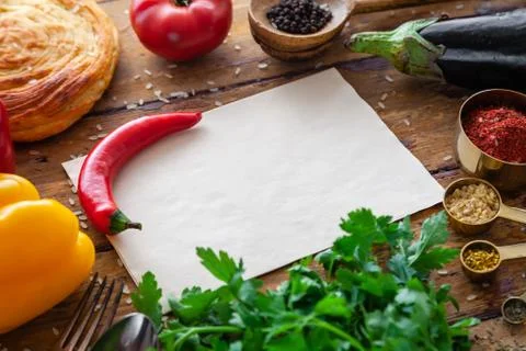 Pilaf ingredients on rustic surface with space for your recipe on paper Stock Photos