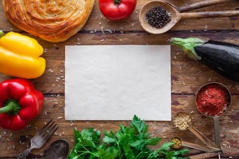 Pilaf ingredients on rustic surface with space for your recipe on paper Stock Photos