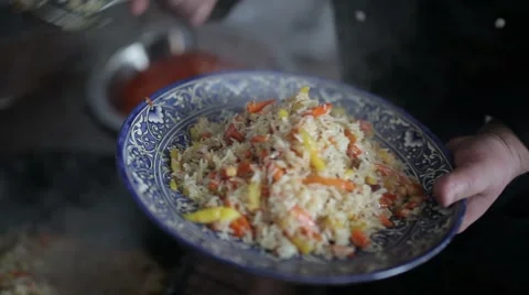 Pilaf poured a large spoon on a beautiful plate. Stock Footage 65813162