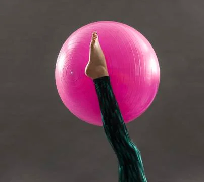 Pilates ball on dark background Stock Photos