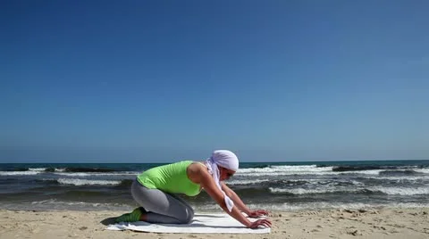 Pilates on the beach Stock Footage 24638342