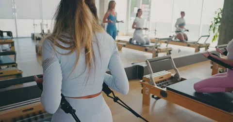 Pilates Class in a Modern Studio with Reformers 스톡 동영상 324871686