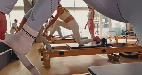 Pilates Class with Reformers in a Modern Studio 스톡 동영상 323945904
