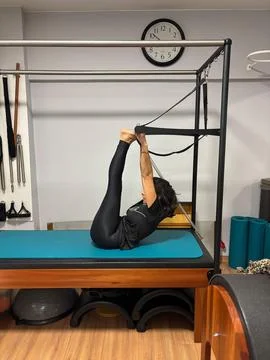 Pilates Exercise on the Reformer Stock Photos