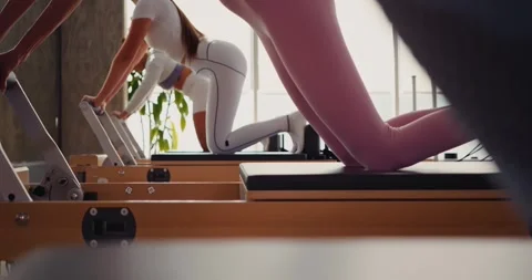 Pilates Training in a Modern Studio Setting Stock Footage 323931779