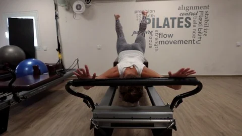 Pilates workout on a reformer Stock Footage 120341335