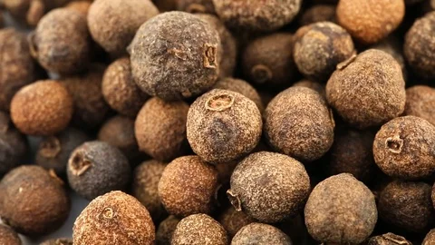 Pile of allspice berries rotating close up macro view - allspice berries are Stock Footage 106216350