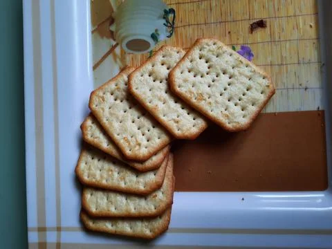 Pile and heap of a rectangle shape Salt Biscuit in a serving plate Stock Photos