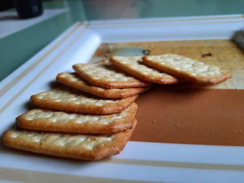 Pile and heap of a rectangle shape Salt Biscuit in a serving plate Stock Photos