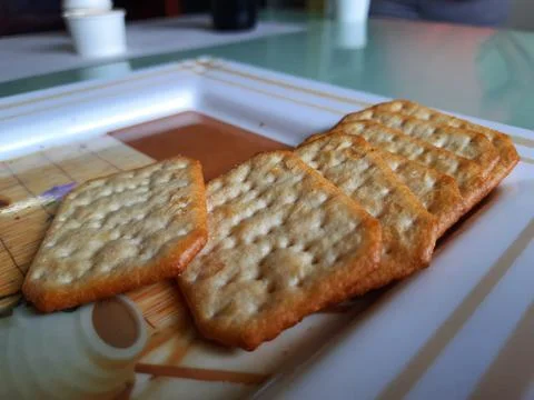 Pile and heap of a rectangle shape Salt Biscuit in a serving plate Stock Photos