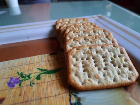 Pile and heap of a rectangle shape Salt Biscuit in a serving plate Stock Photos