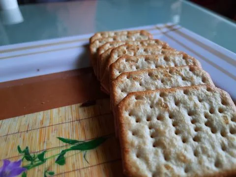 Pile and heap of a rectangle shape Salt Biscuit in a serving plate Stock Photos