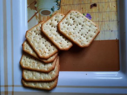 Pile and heap of a rectangle shape Salt Biscuit in a serving plate Stock Photos