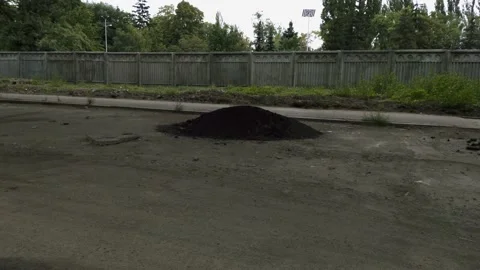 A pile of asphalt in the middle of a bumpy road Stock Footage 138560963