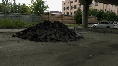 A pile of asphalt in the middle of a bumpy road Stock Footage 138561113