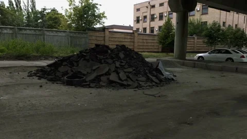 A pile of asphalt in the middle of a bumpy road Stock Footage 138561137
