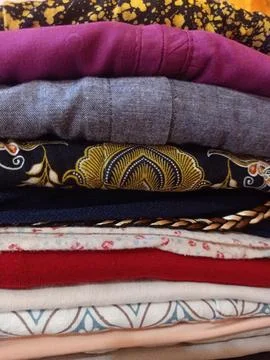A Pile of Assorted Folded Clothes Stock Photos