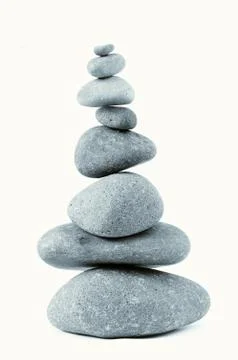 Pile of balanced rocks on plain background Stock Photos