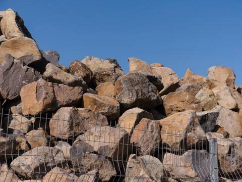 Pile of basalt to build a new harbor. Stock Photos