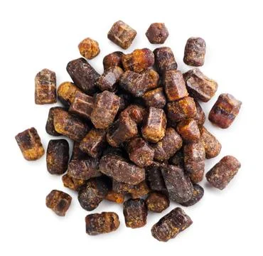 Pile of bee bread close-up on a white background. Top view Stock Photos