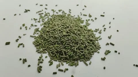 Pile of bird pellets on white background Stock Footage 309847563