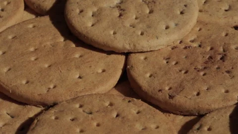 Pile of biscuits background rotating macro. Unhealthy eating. Stock Footage 285926134
