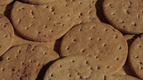 Pile of biscuits background rotating macro. Unhealthy eating. Stock Footage 285926162