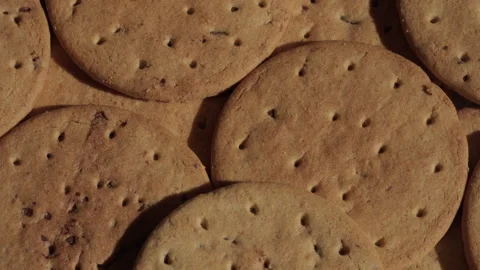 Pile of biscuits background rotating macro. Unhealthy eating. Stock Footage 285926164