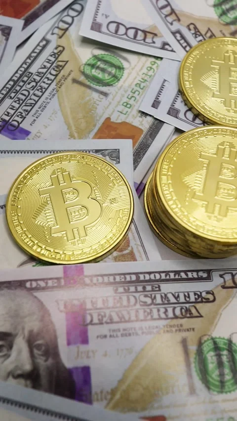 Pile of Bitcoins on US Dollar Notes. Stock Footage 289434753