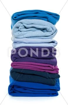 Pile of blue and purple folded clothes Stock Photos