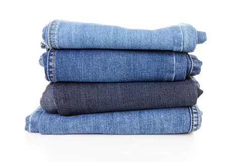 Pile of blue jeans Stock Photos