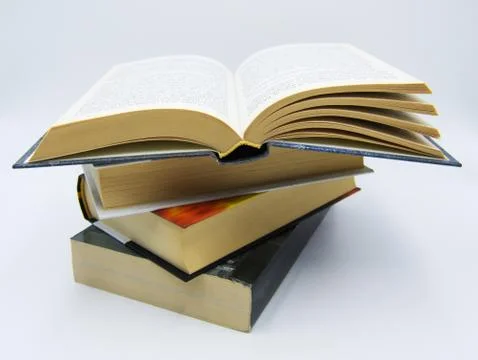 Pile of books on a table in white background Stock-Fotos