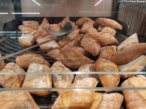 Pile of bread and shovel Stock Photos