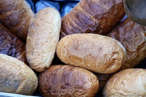 Pile of bread baked in close-up. Stock Photos