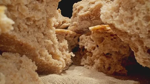Pile of bread pieces. Camera moving through row of fresh breads. Macro Video stock 252038509