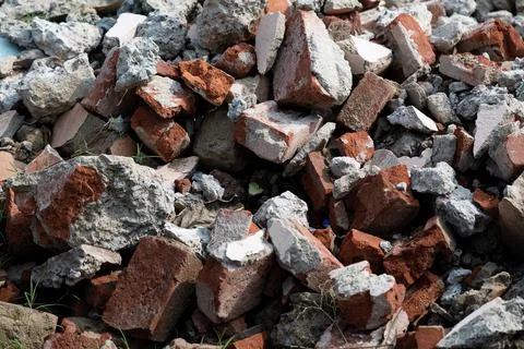Pile of bricks concrete construction garbage at a demolished site Stock Photos