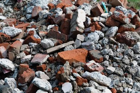 Pile of bricks concrete construction garbage at a demolished site Stock Photos
