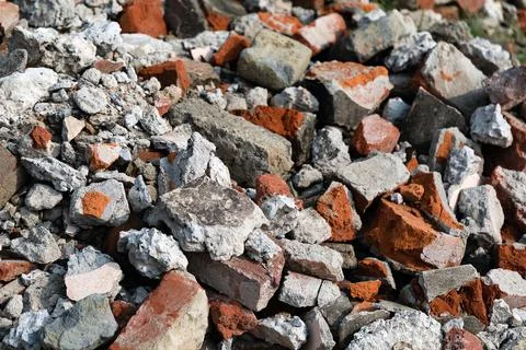 Pile of bricks concrete construction garbage at a demolished site Stock Photos