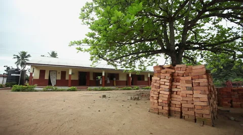PILE OF BRICKS IN FRONT OF SCHOOL Stock Footage 59735305