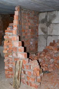 Pile of Bricks by an Old Brick Wall taken by an old building in St. Petersburg Stock Photos