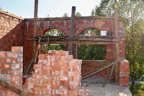 Pile of Bricks by an Old Brick Wall taken by an old building in St. Petersburg Stock Photos