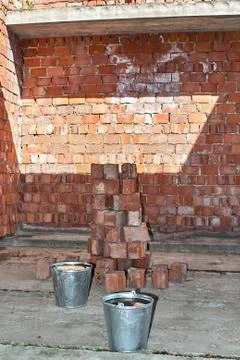 Pile of Bricks by an Old Brick Wall taken by an old building in St. Petersburg Stock Photos